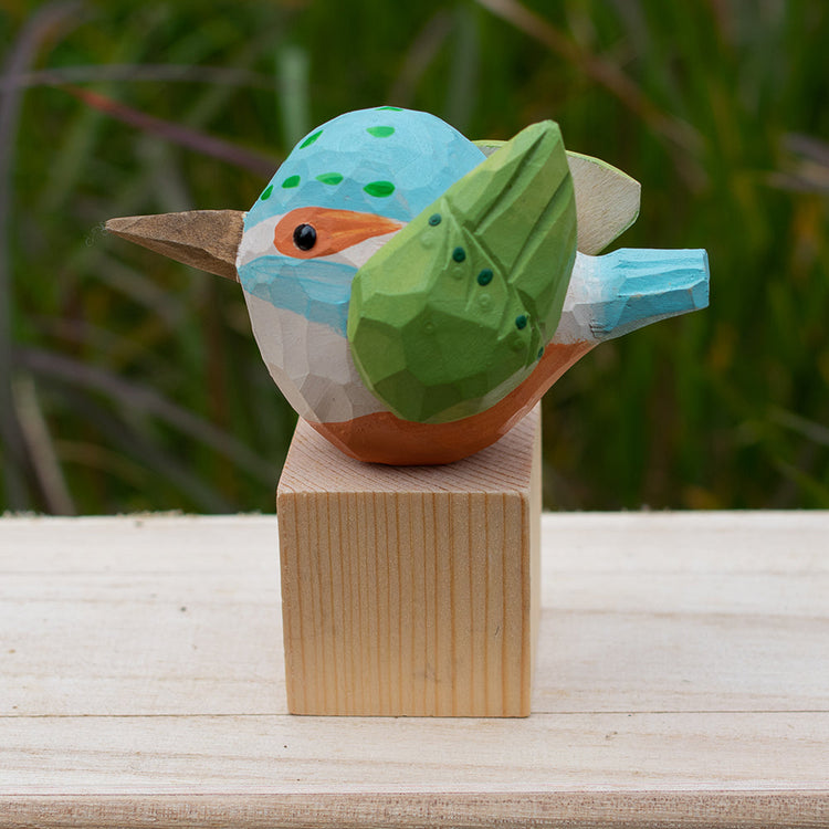 Hand-carved wooden bird figurines designed with creativity and imagination. 