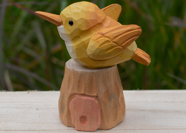 Handcrafted wooden display stands designed to showcase wooden animal figurines elegantly.