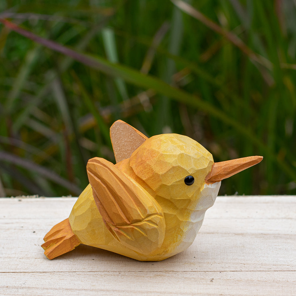 Hand-carved wooden robin figurine with earthy red and brown accents, designed for bird lovers.