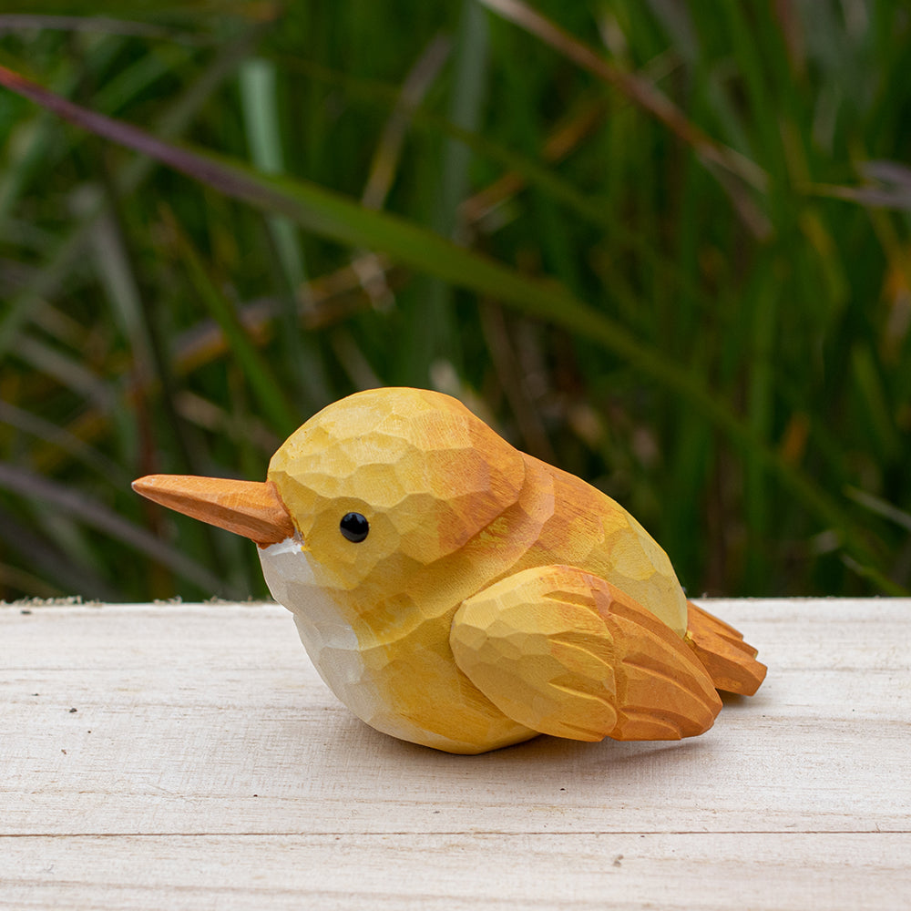 Hand-carved wooden robin figurine with earthy red and brown accents, designed for bird lovers.