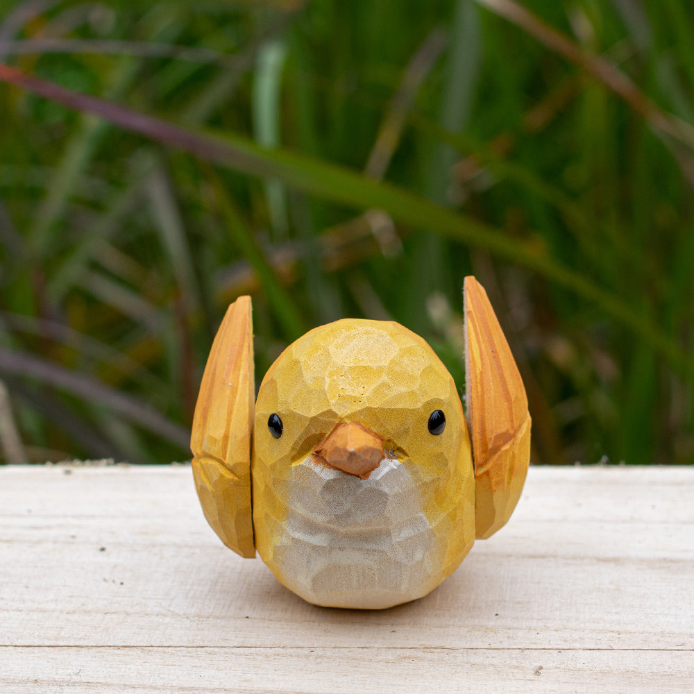 Hand-carved wooden robin figurine with earthy red and brown accents, designed for bird lovers.