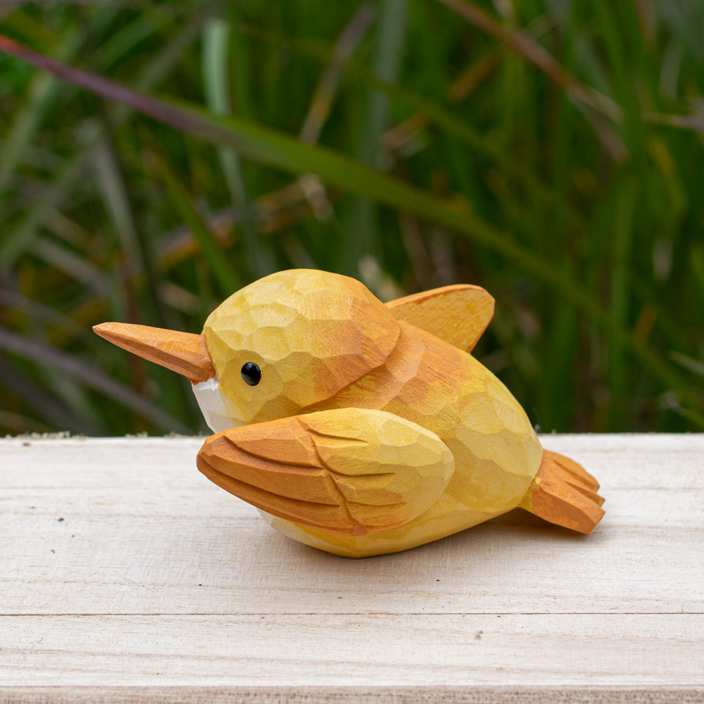 Hand-carved wooden robin figurine with earthy red and brown accents, designed for bird lovers.