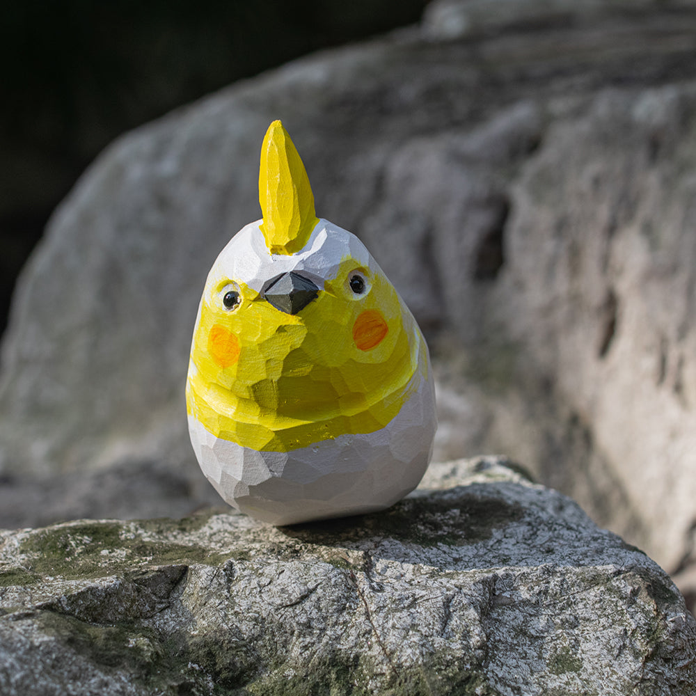 Hand-carved wooden figurine of a Lutino Cockatiel, an ornament great for home decor and gifts. 
