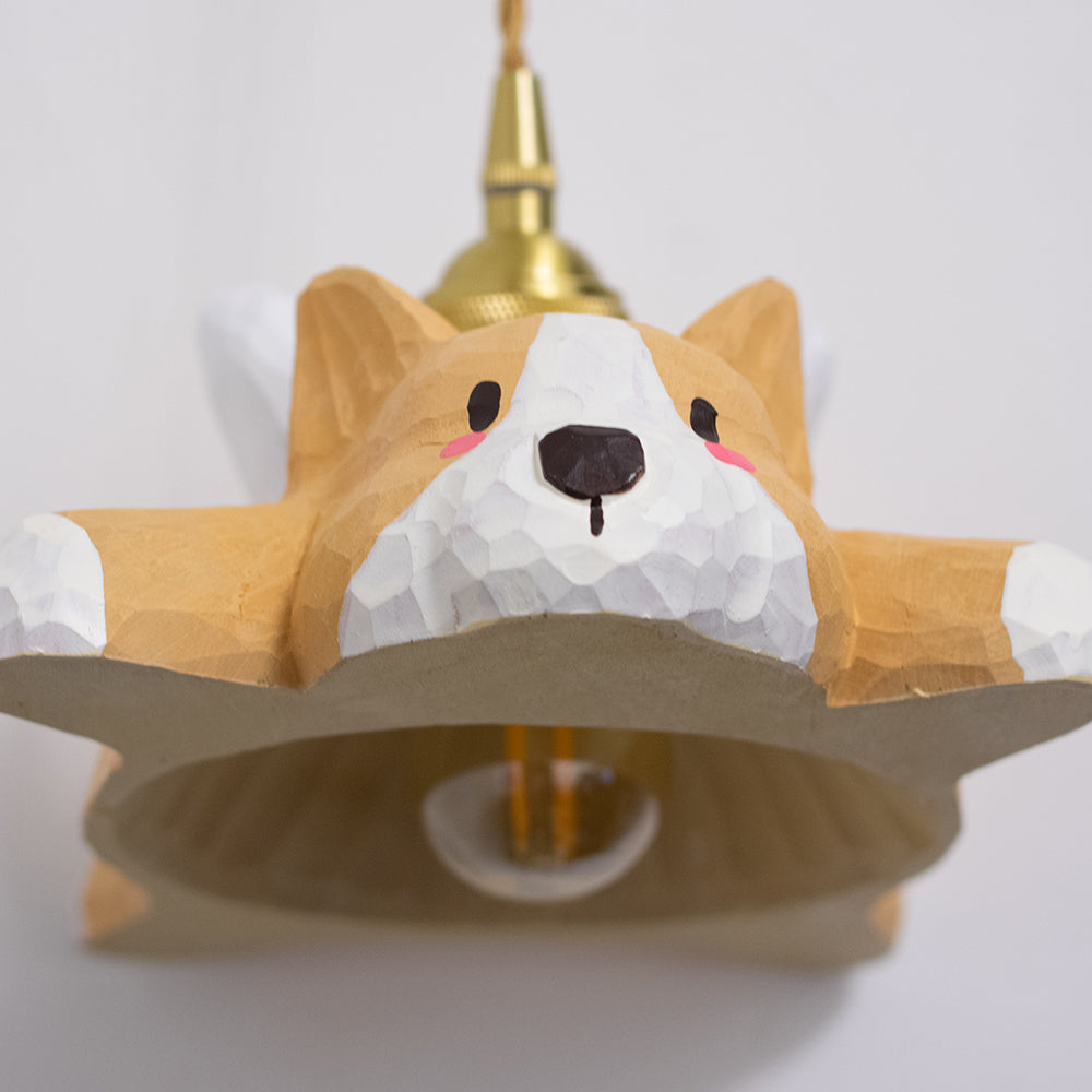 Hand-carved wooden corgi pendant light, available as a ceiling-mounted or plug-in wood pendant lamp, crafted from natural wood.