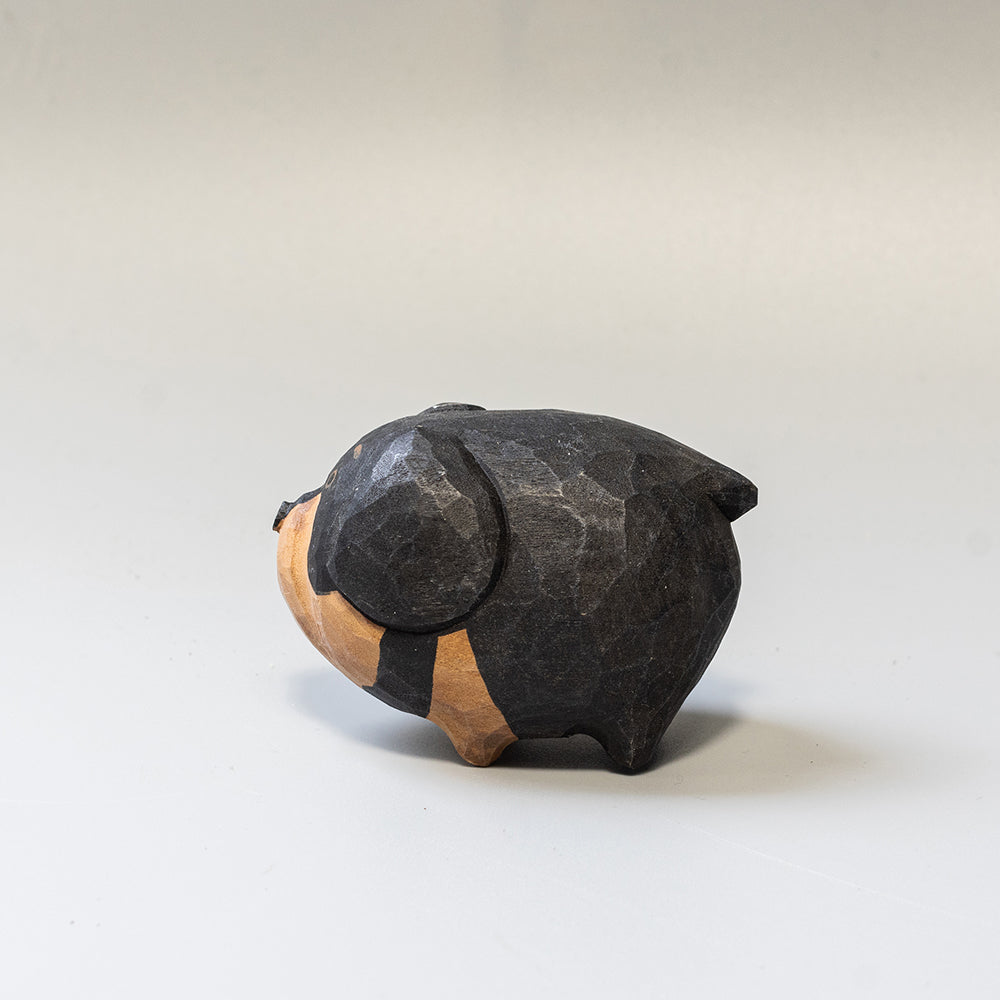 Hand-carved wooden Dachshund figurine from the Puffed Pups series. A cute, rounded wood carving by Woorai. 