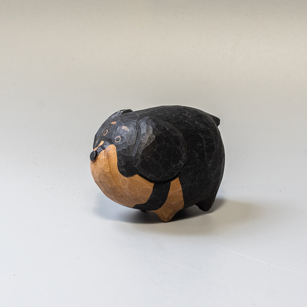 Hand-carved wooden Dachshund figurine from the Puffed Pups series. A cute, rounded wood carving by Woorai. 
