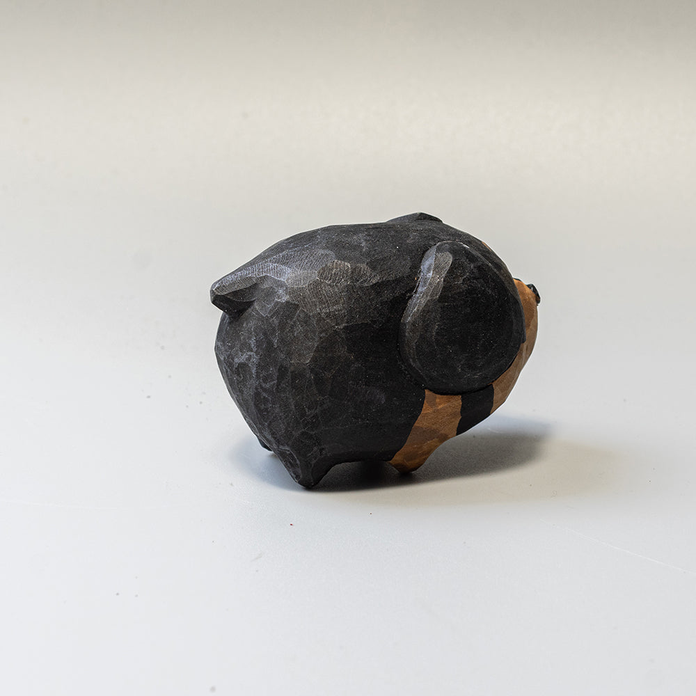Hand-carved wooden Dachshund figurine from the Puffed Pups series. A cute, rounded wood carving by Woorai. 