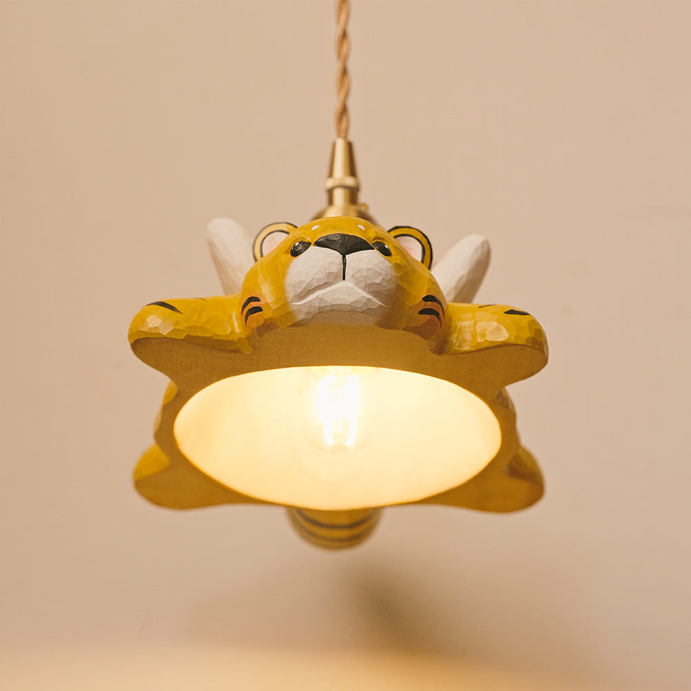 Hand-carved wooden tiger pendant light with a playful flying design. A whimsical statement piece for unique lighting setups.