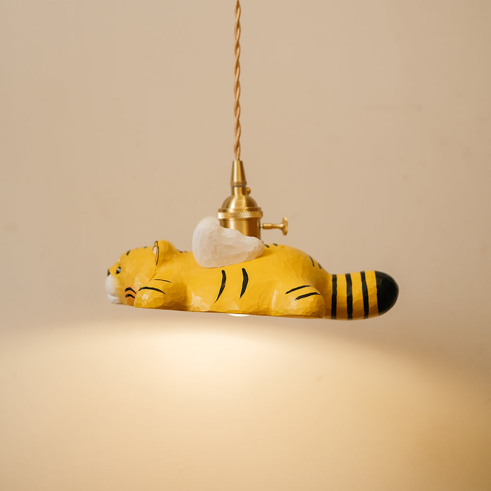 Hand-carved wooden tiger pendant light with a playful flying design. A whimsical statement piece for unique lighting setups.