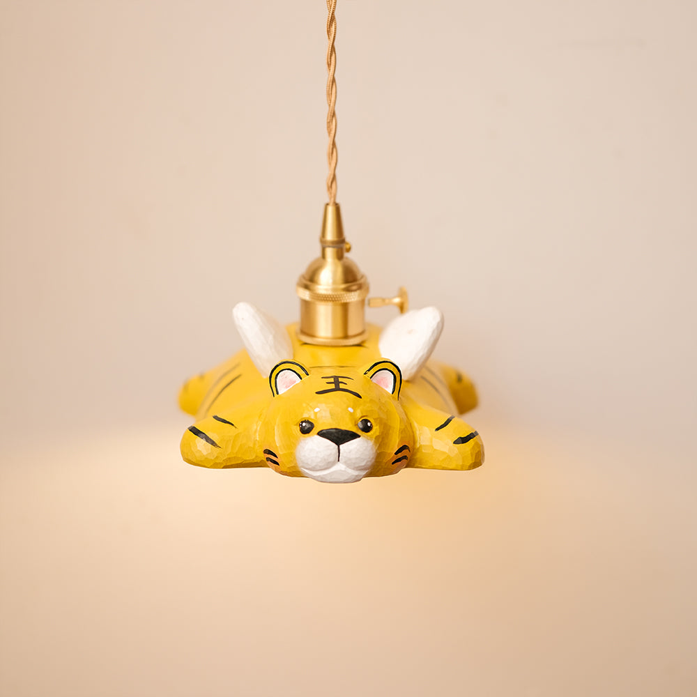 Hand-carved wooden tiger pendant light with a playful flying design. A whimsical statement piece for unique lighting setups.