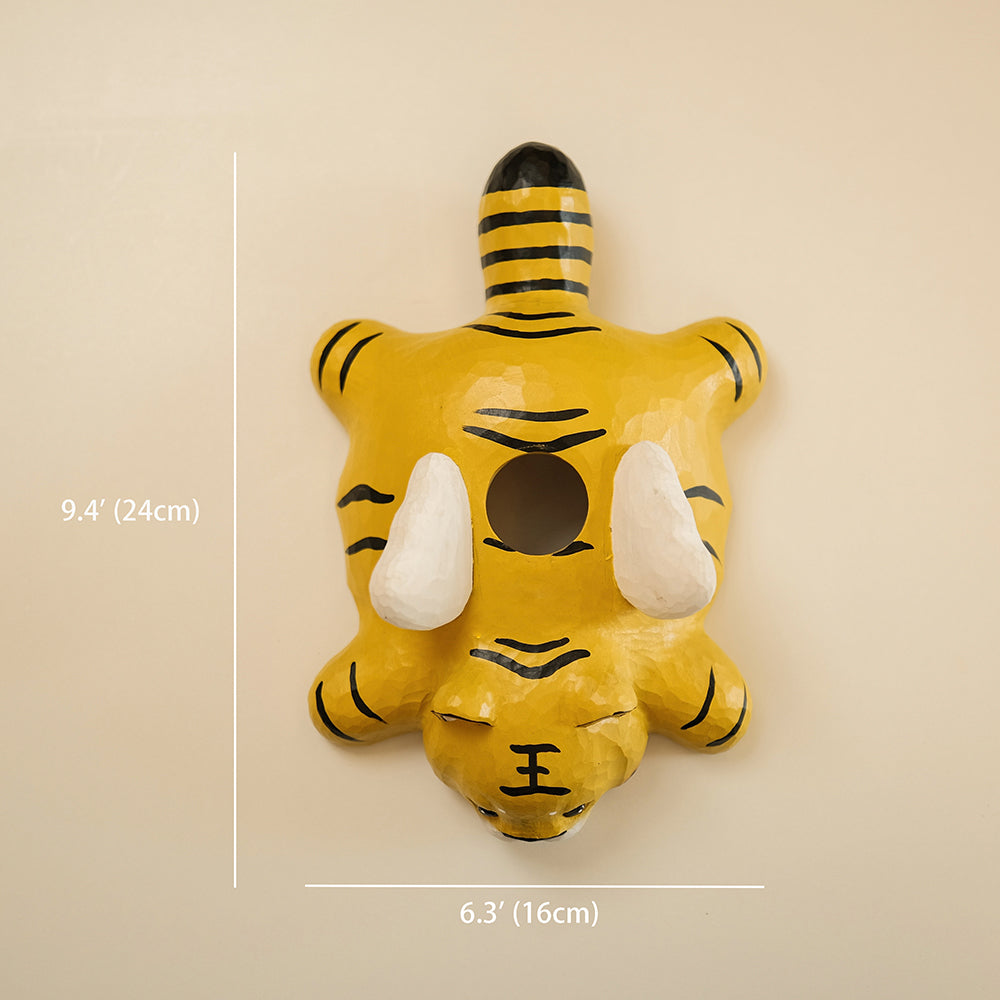 Hand-carved wooden tiger pendant light with a playful flying design. A whimsical statement piece for unique lighting setups.