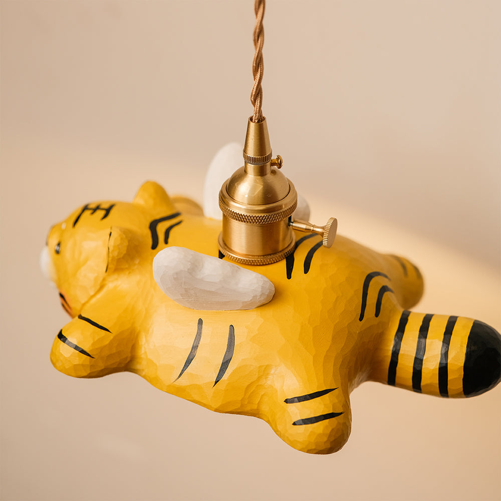 Hand-carved wooden tiger pendant light with a playful flying design. A whimsical statement piece for unique lighting setups.