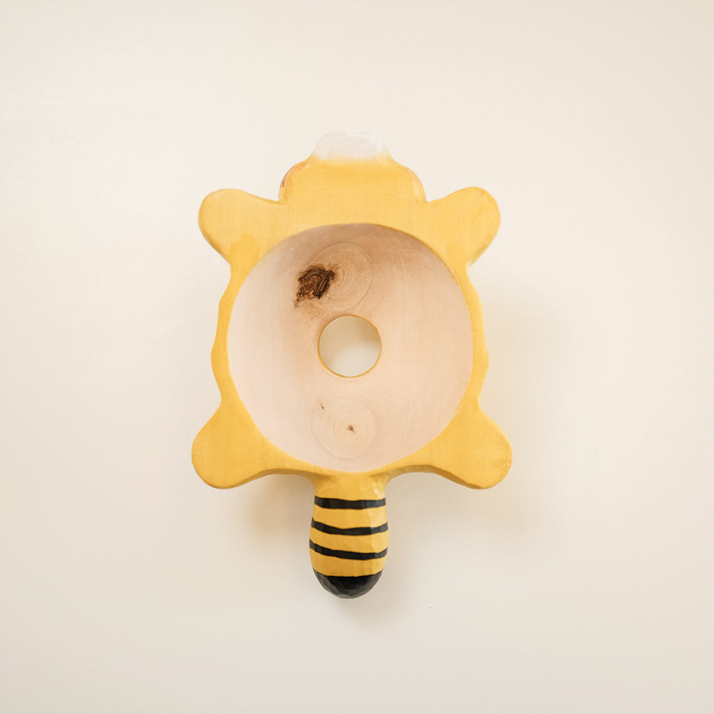 Hand-carved wooden tiger pendant light with a playful flying design. A whimsical statement piece for unique lighting setups.
