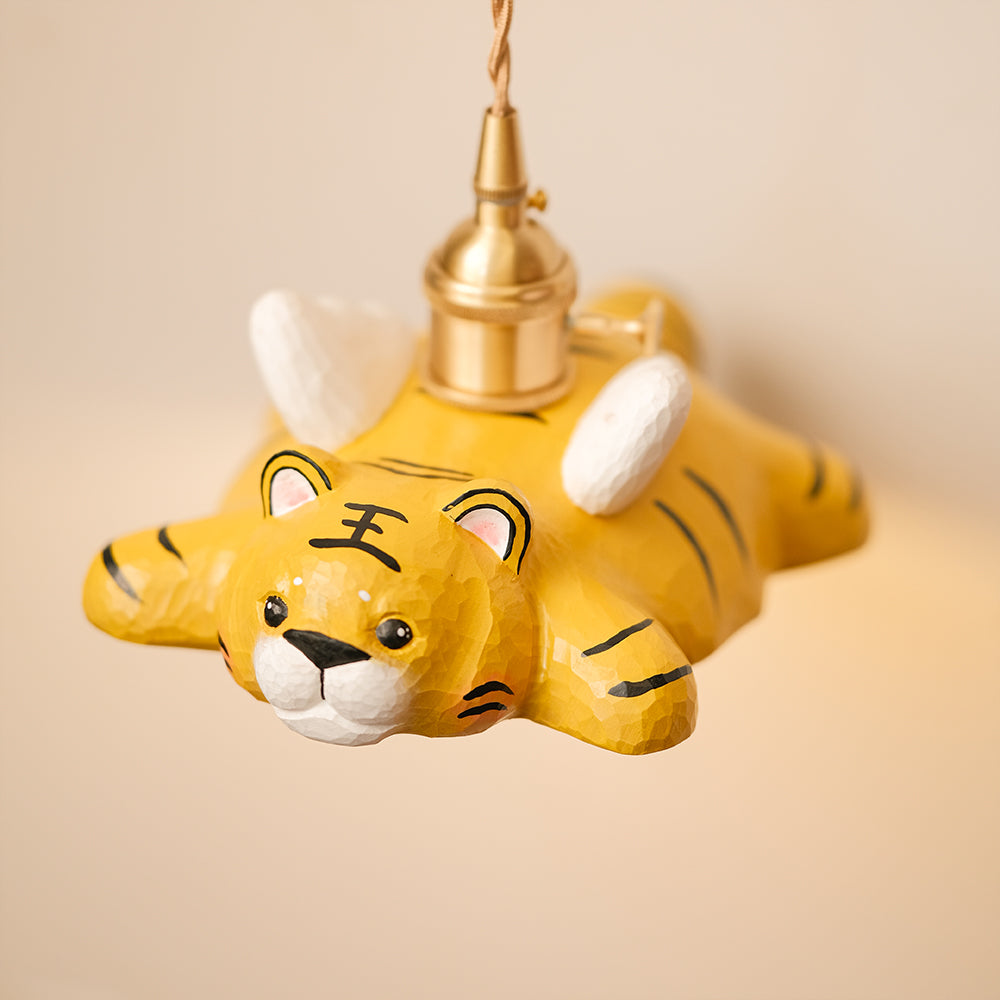 Hand-carved wooden tiger pendant light with a playful flying design. A whimsical statement piece for unique lighting setups.