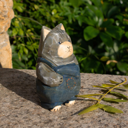 Hand-carved wooden figurine of a gray tabby cat in overalls, a rustic home decor piece for cat lovers.