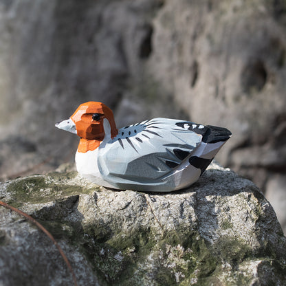 A hand-carved wooden figurines of a  rustic duck. Free shipping for orders over $69.