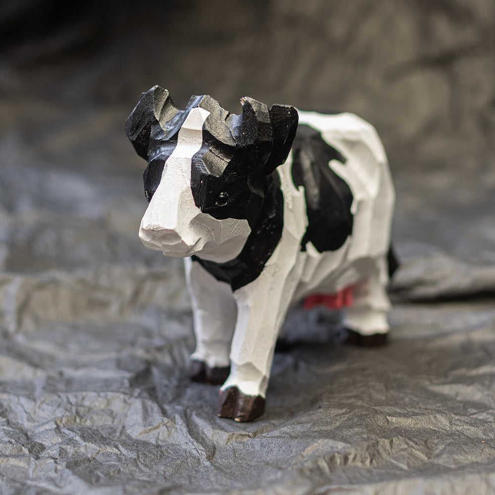 Hand-carved wooden Holstein cow figurine, an ornament great for home decor and gifts. 