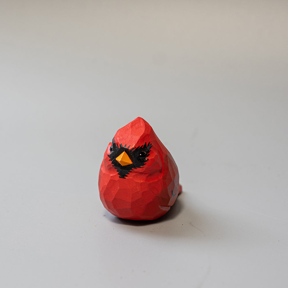 Hand-carved wooden Male Cardinal figurine in brilliant red with black mask and crest. A striking wood bird figure. 