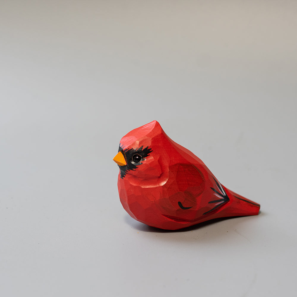 Hand-carved wooden Male Cardinal figurine in brilliant red with black mask and crest. A striking wood bird figure.