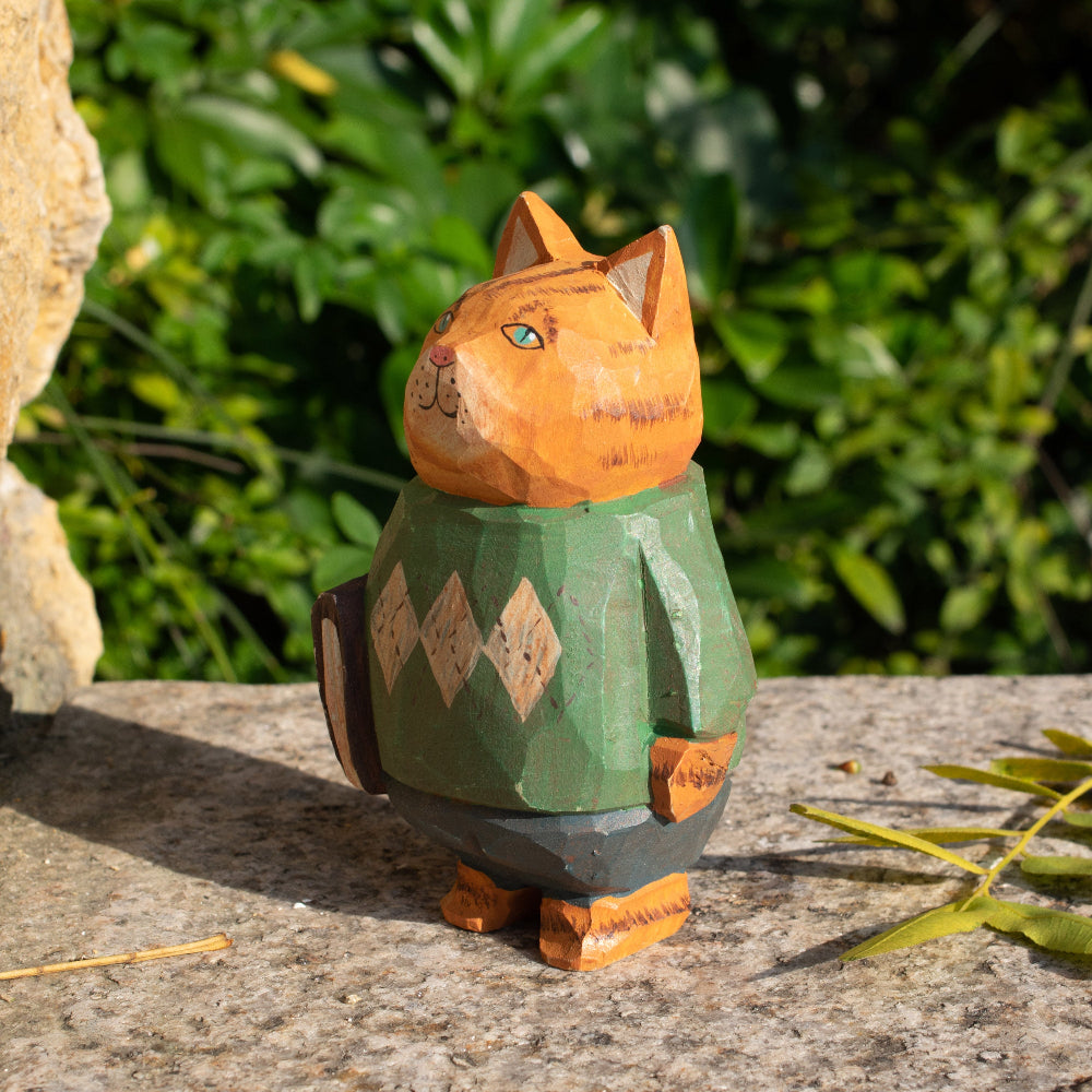 Hand-carved wooden figurine of a tabby cat with a book, perfect for cat lovers and unique home decor.