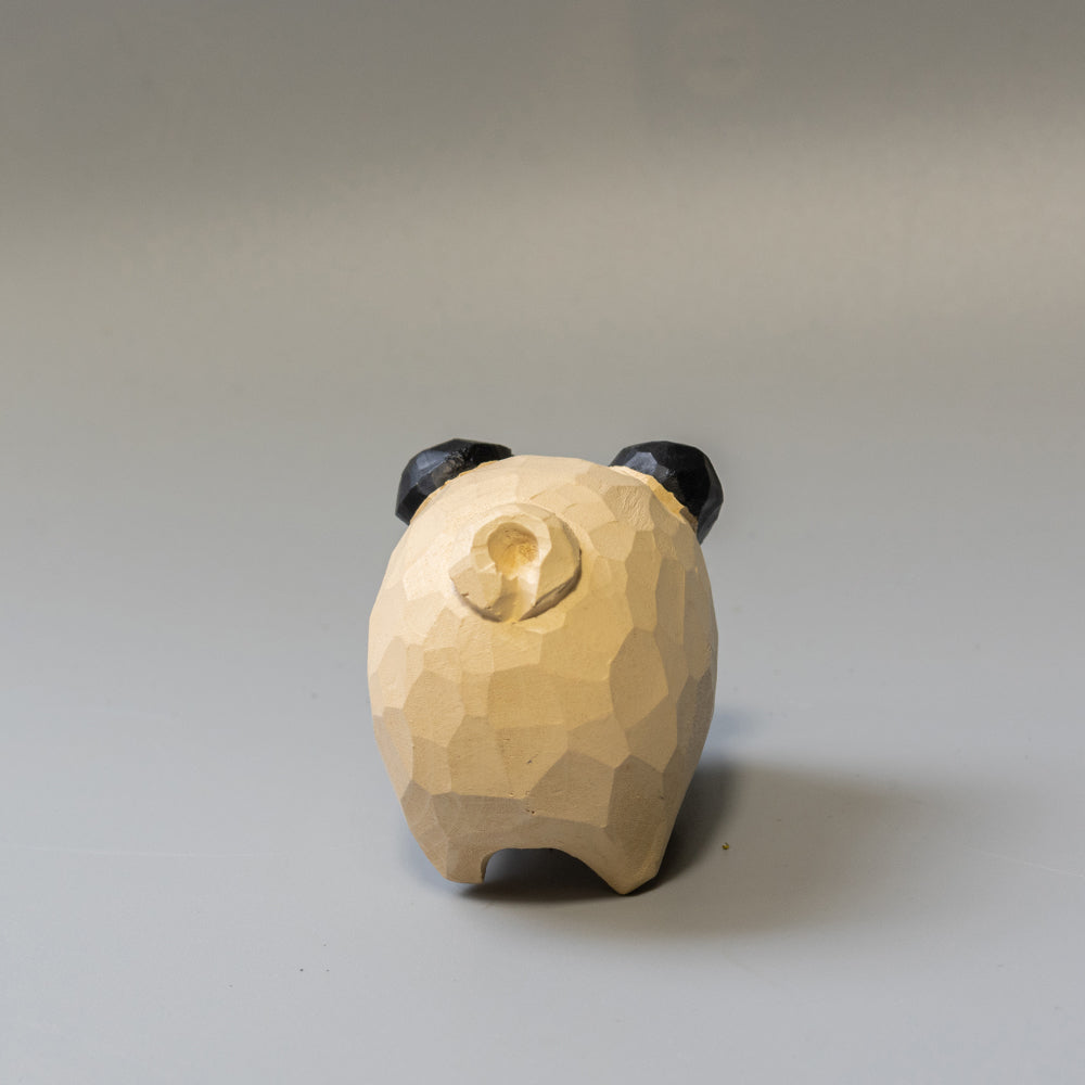Hand-carved wooden Pug figurine with artfully rounded wrinkles and curled tail. 