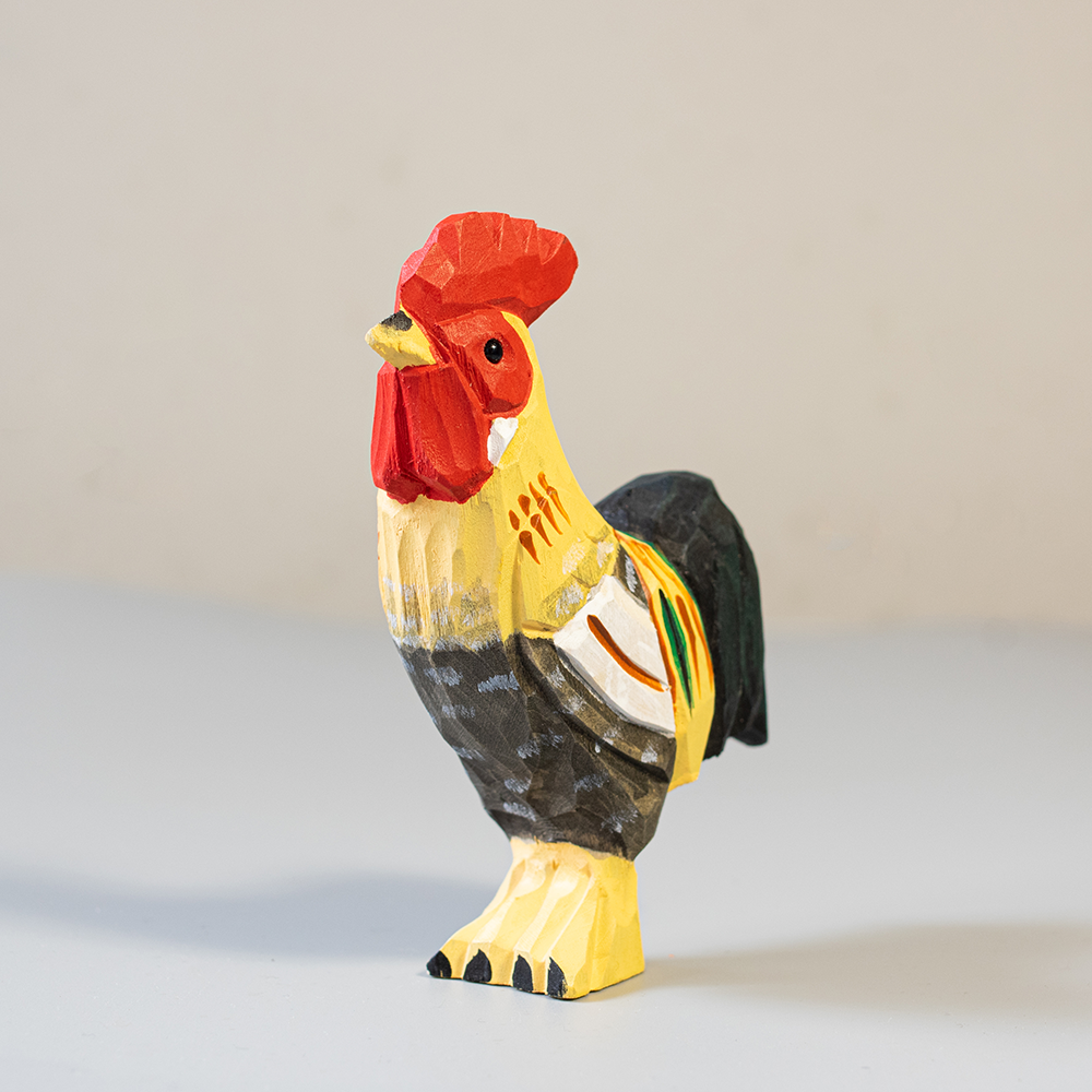 Colorful rooster figurine on a light background