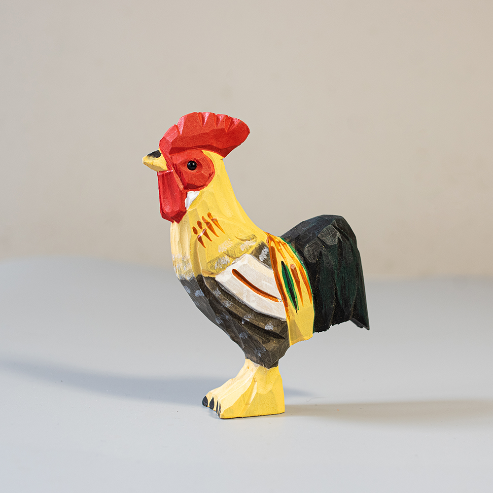 Colorful rooster figurine on a light gray background