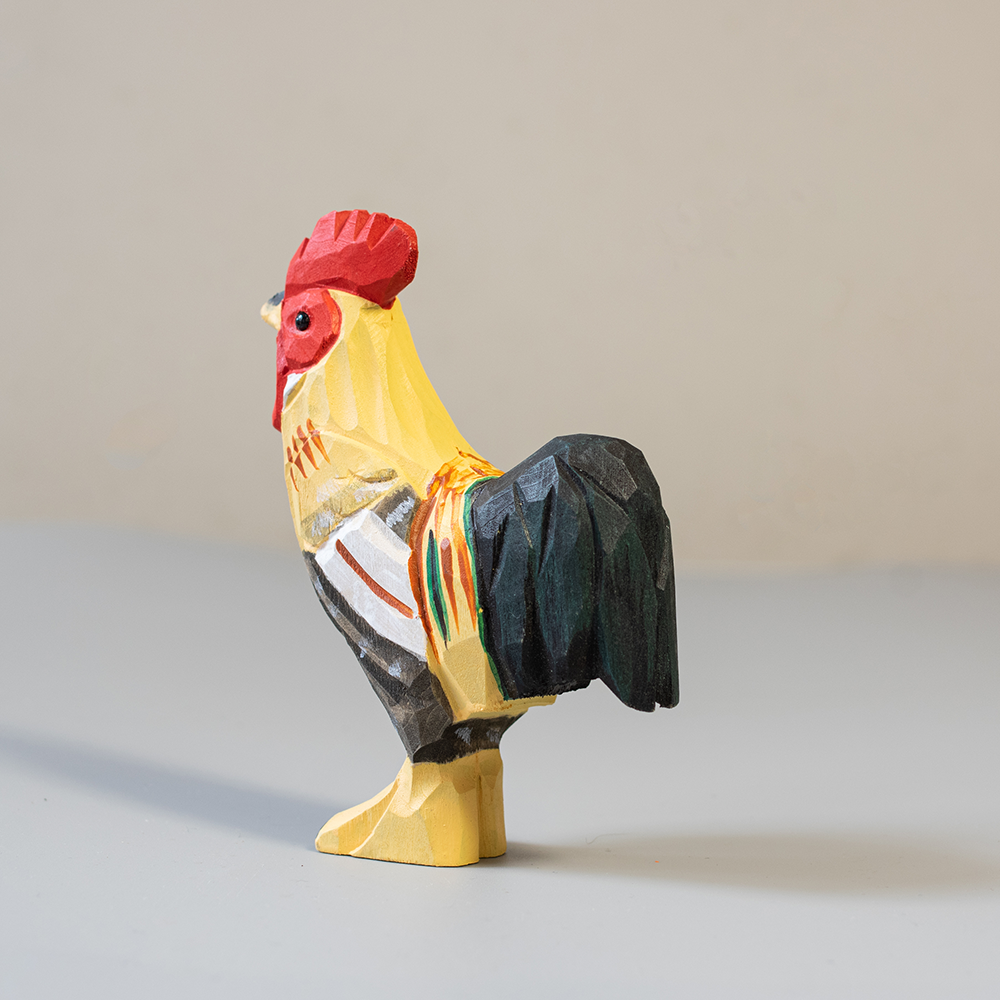 Colorful rooster figurine on a neutral background