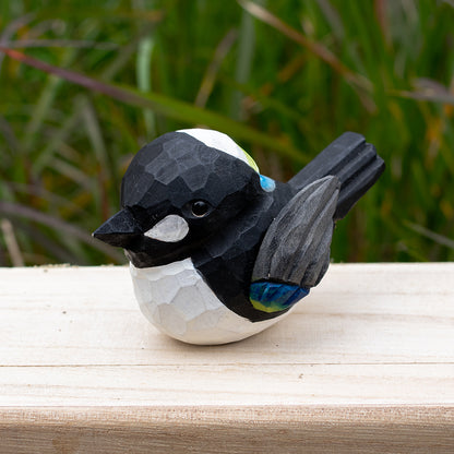 Artistic hand-carved wooden magpie figurine in bold black and white tones from the Odd Flocks series.