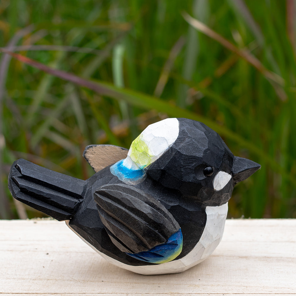 Artistic hand-carved wooden magpie figurine in bold black and white tones from the Odd Flocks series.