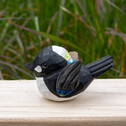 Artistic hand-carved wooden magpie figurine in bold black and white tones from the Odd Flocks series.