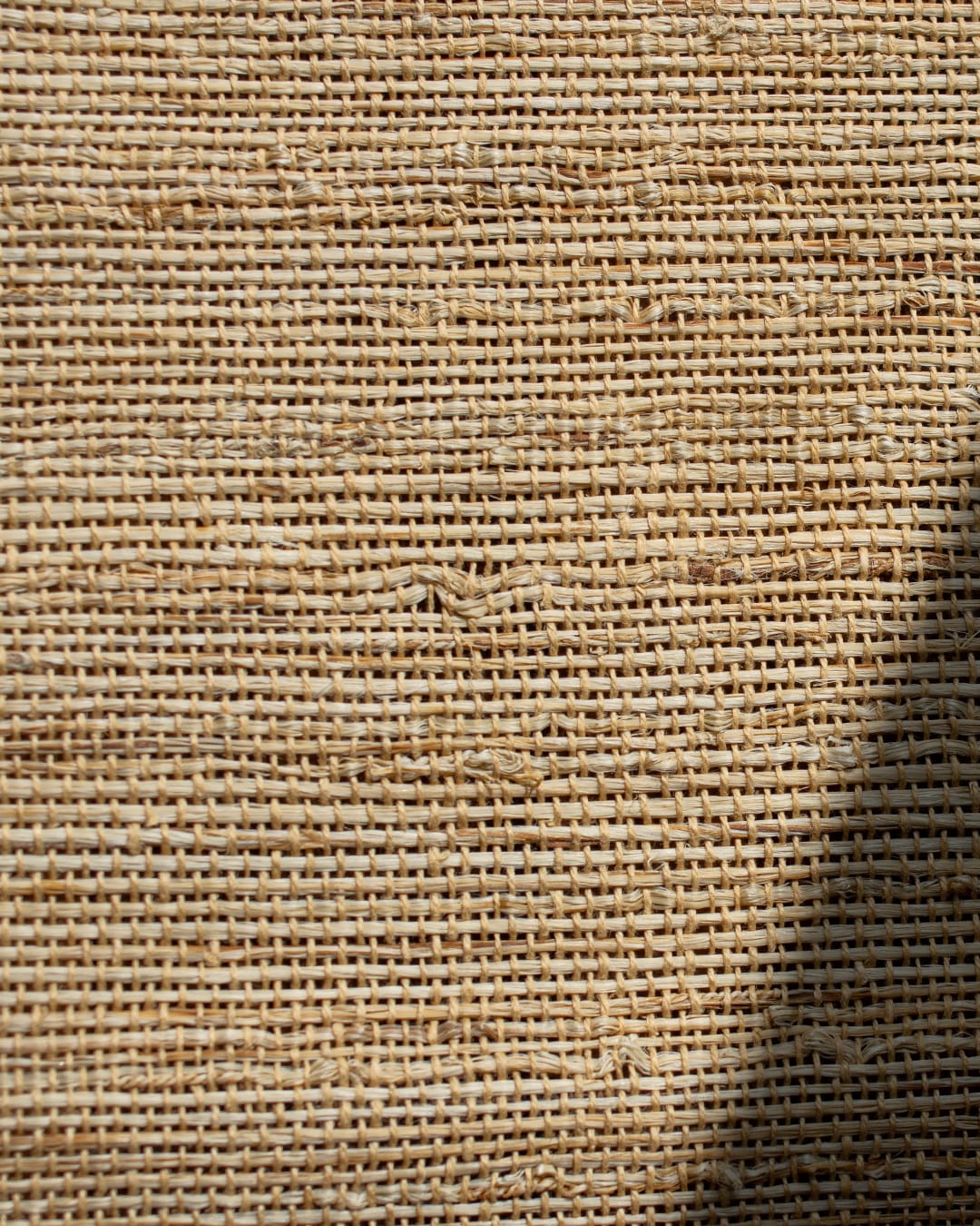 Close up of a hand-woven table runner made of natural ramie fiber.