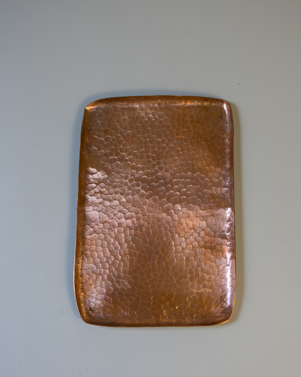 A rectangular, hand-hammered solid copper tray with a textured Tsuchime surface on a white background.