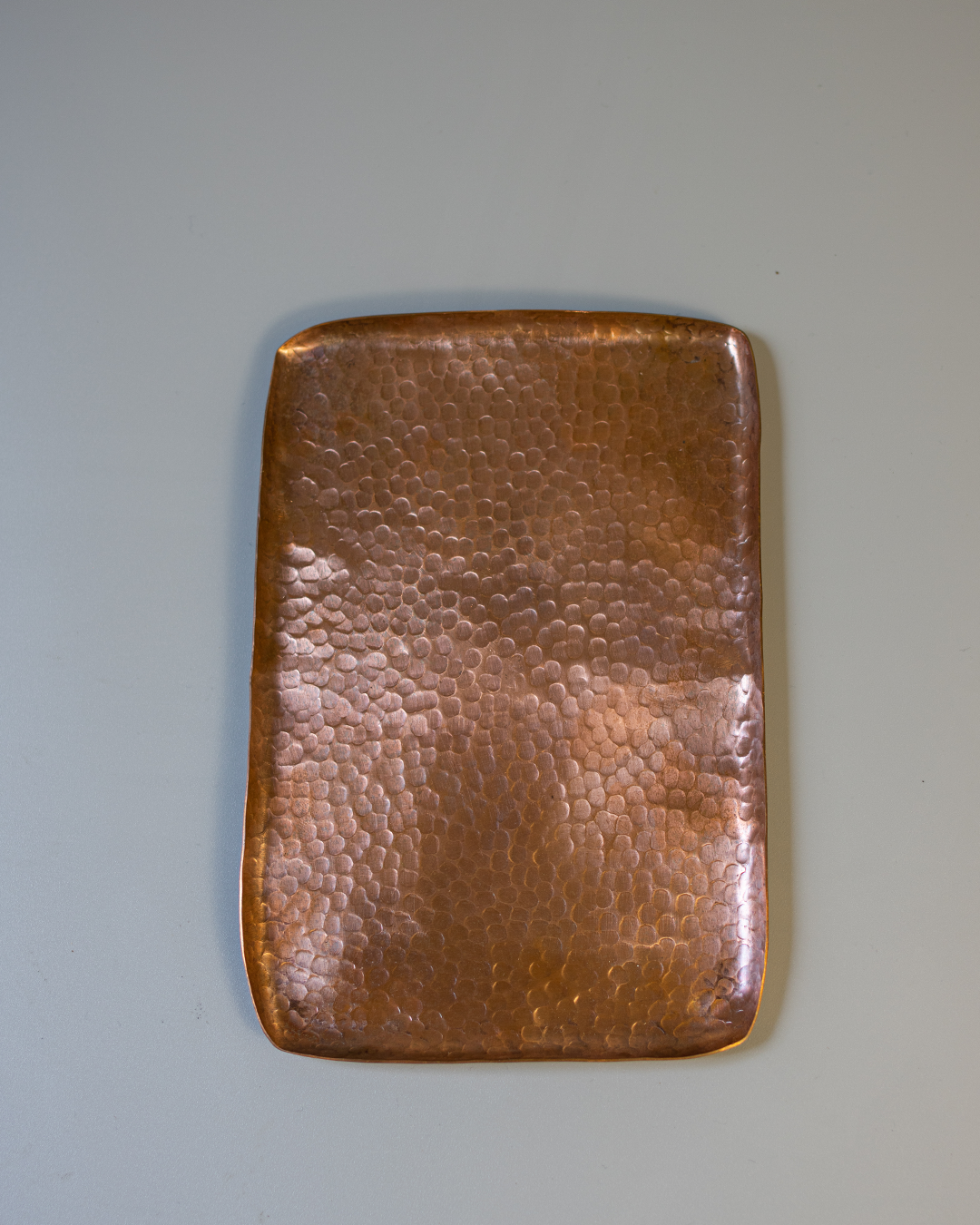 A rectangular, hand-hammered solid copper tray with a textured Tsuchime surface on a white background.