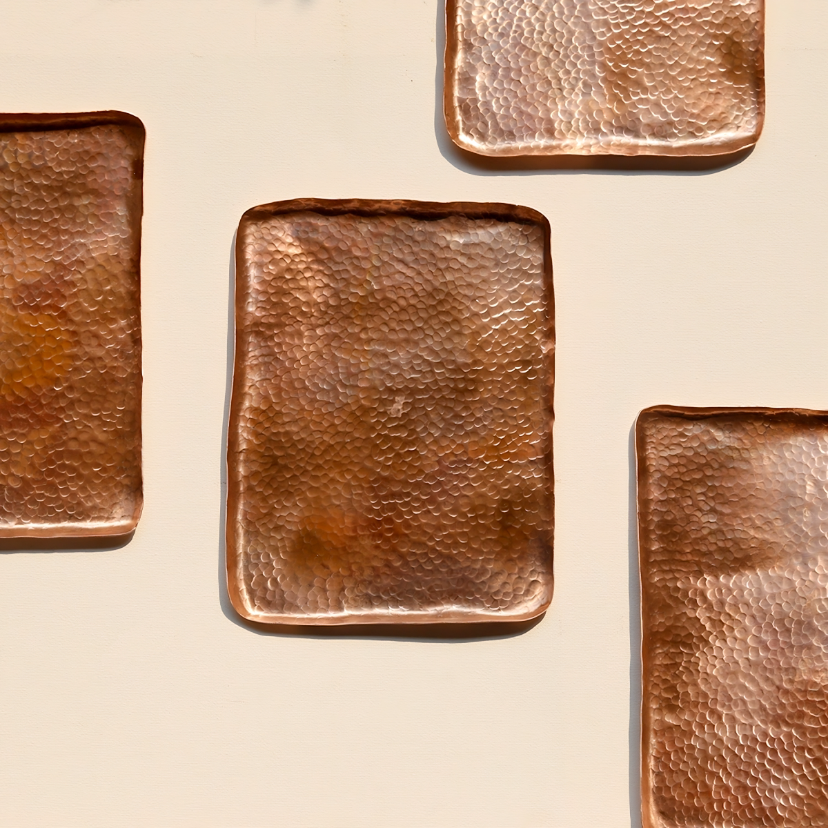 4 rectangular, hand-hammered solid copper trays with textured Tsuchime surface.
