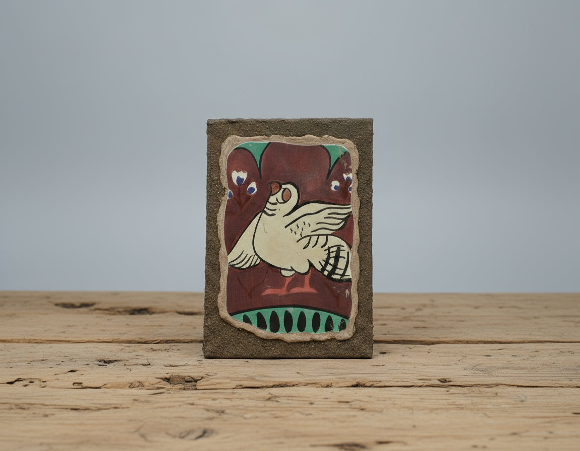 A Kucha-style fresco panel depicting a mythical bird in red, white, and green mineral pigments.