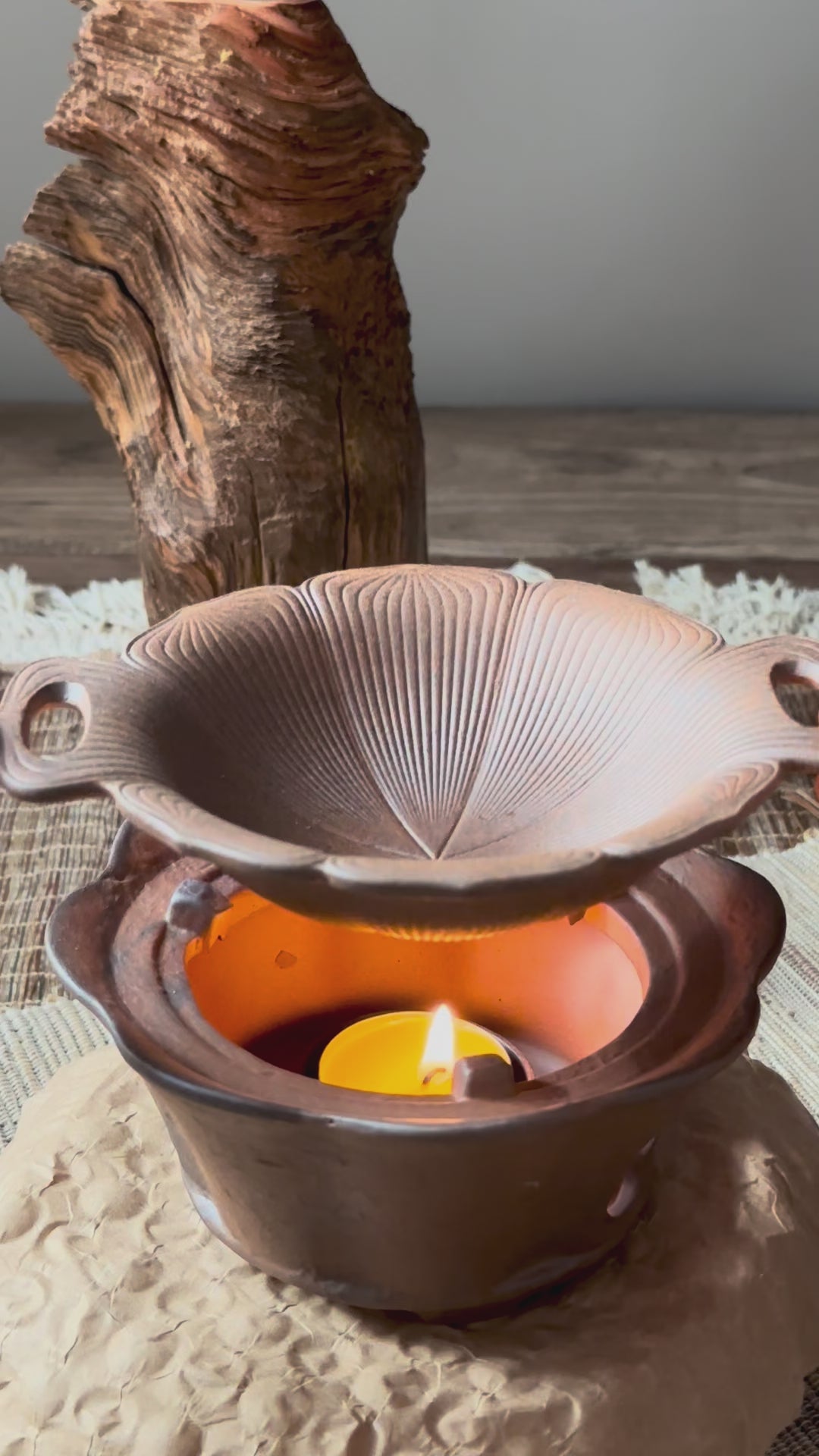 A rustic, two-piece ceramic aromatic warmer made from dark Aged Ore Clay.